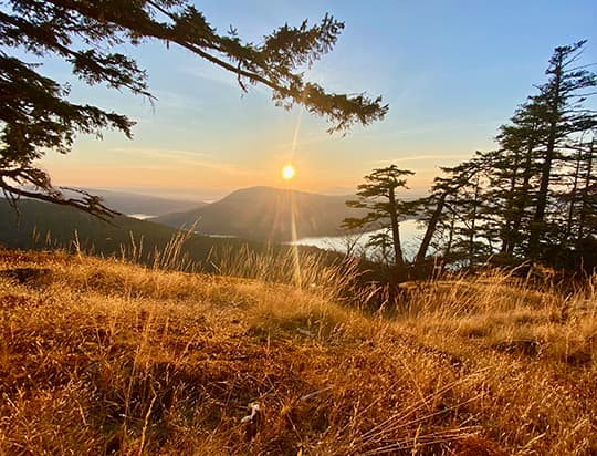 View of sunset on a clear day from high up on Salt Spring Island